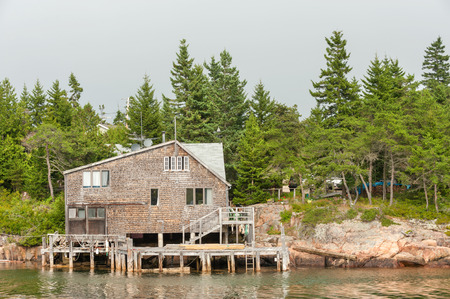 Typical New England shingled waterfront house on Schoodic Peninsula near Acadia National park, Maineの写真素材