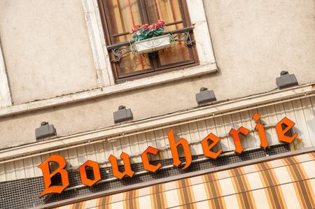 Local butcher shop (sign in French) in small French town in Normandy, Franceの写真素材