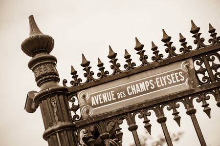 Avenue des Champs-Elysees street sign on typical wrought iron metal fence, Paris, Franceの写真素材