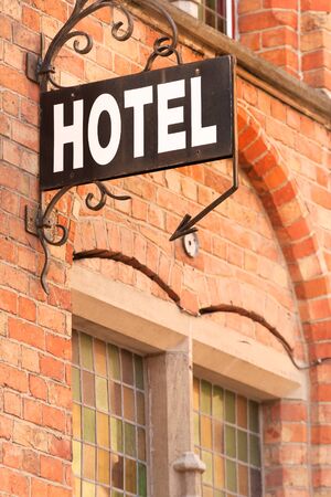 Hotel sign at the entrance of cozy accommodation in European cityの写真素材