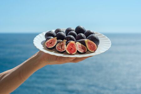 Welcome plate of figs with the Black Sea backdrop, Crimeaの写真素材