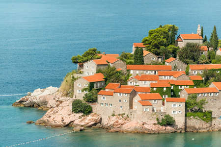 Red tiled roofs of famous Sveti Stefan island on Adriatic coast, Montenegroのeditorial素材