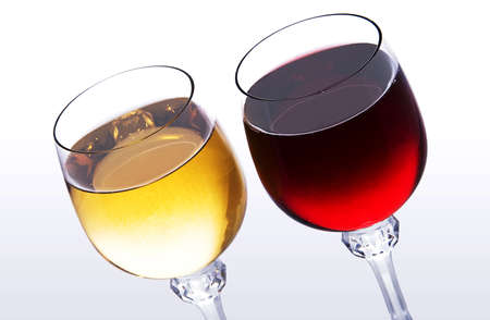 two glasses with red and white wine on light backgroundの写真素材
