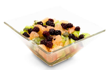 fruit salad of kiwi, grapefruit and blackberry in a glass salad bowlの写真素材