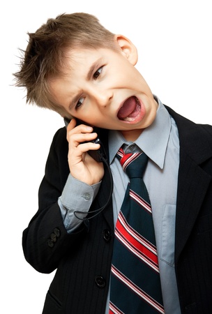  Boy In Suit Yelling Into Cellphone over white backgroundの写真素材