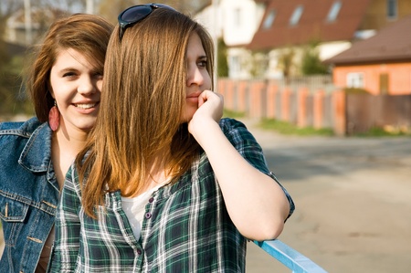 Portrait of two young girls outdoorの写真素材
