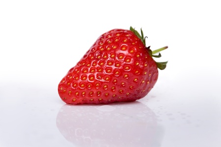One strawberriy isolated on white background with reflectionの写真素材