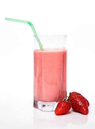 strawberry milkshake with three strawberries isolated on white backgroundの写真素材