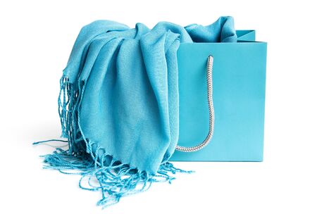 Blue scarf in shopping bag against white backgroundの写真素材
