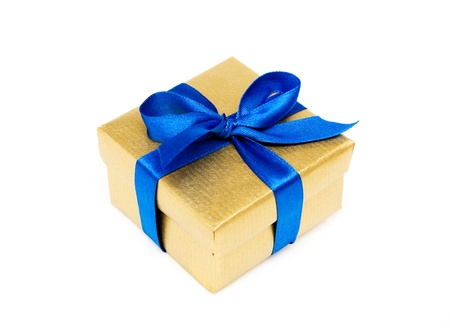 golden gift box with a blue ribbon on a white backgroundの写真素材