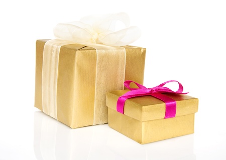 two golden gift boxes isolated on a white backgroundの写真素材
