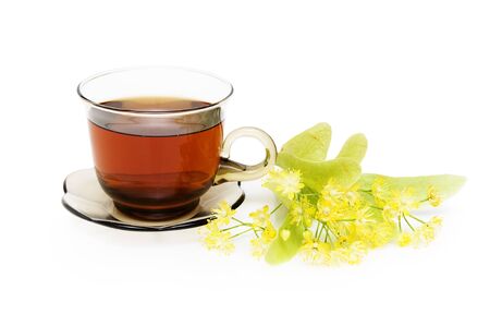 Herbal tea with Linden in glass cup over white backgroundの写真素材