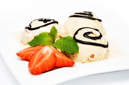 Iice cream with coffee flavour on white plate, isolated on a white backgroundの写真素材