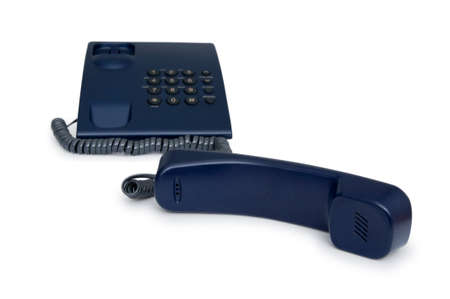 black telephone with focus on the handset in the foreground.の写真素材