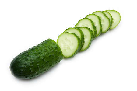 ripe fresh chopped cucumber isolated on a white backgroundの写真素材