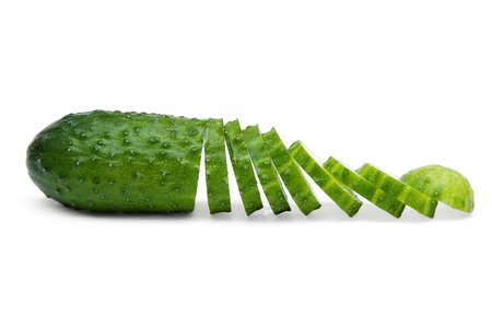 ripe fresh chopped cucumber isolated on a white backgroundの写真素材