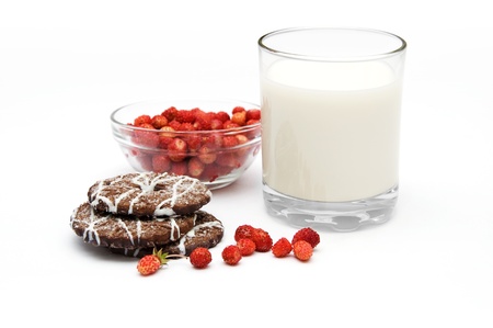Glass of milk with wild strawberries and cookies isolated on a white backgroundの写真素材