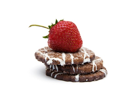 stack of cookies with strawberry on top isolated on white backgroundの写真素材
