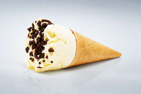 Ice cream in cone on a blue backgroundの写真素材