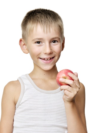 cute boy with red apple isolated on a white backgroundの写真素材