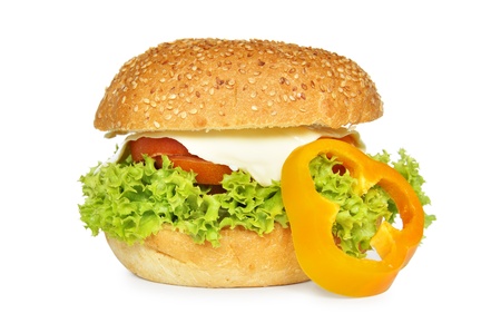 Big vegetarian sandwich with lettuce, tomato, sweet pepper and cheese isolated on white backgroundの写真素材