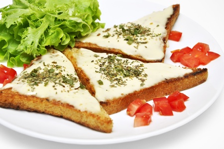 toasts with goat cheese, herbs, lettuce and tomatoの写真素材