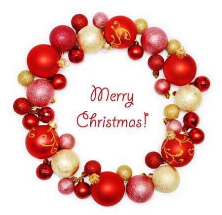 Christmas wreath decoration from red and golden color baubles on white backgroundの写真素材