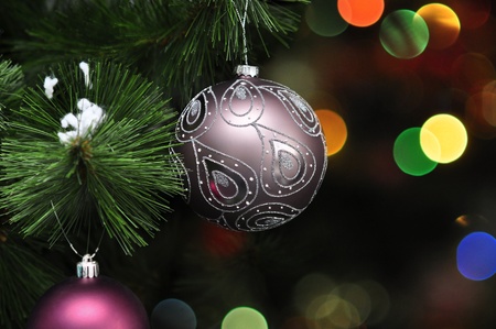 Pink christmas decorations on a christmas fur-treeの写真素材