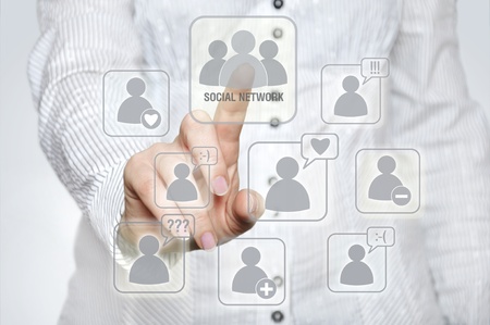 Woman pressing social network button with one handの写真素材