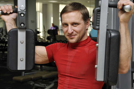  fitness men exercising in the gymの写真素材