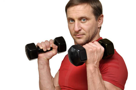 Athletic man  with a dumbells over whiteの写真素材