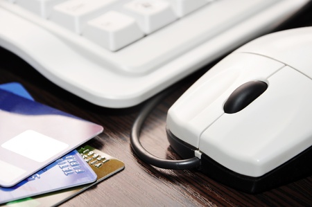 keyboard, mouse, credit card on the table closeupの写真素材