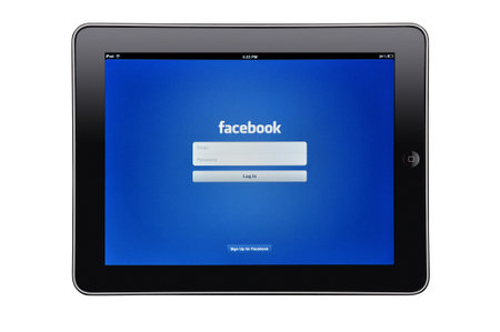 Apple iPad editorial studio shot with facebook app on screenのeditorial素材