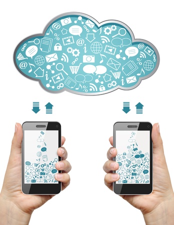 Mobile phones in female hands download information from cloud isolated on white  Cloud computing concept の写真素材