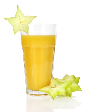 Glass of carambola juice over white backgroundの写真素材