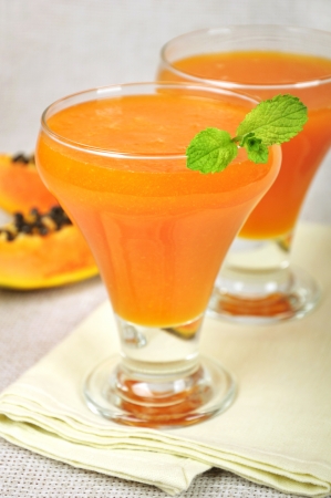 Fresh blended papaya juice with a mint leafの写真素材