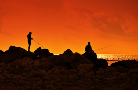 A fishermans in sunset at the coast.の写真素材