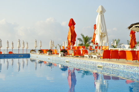 Early morning in empty cafe by the pool on the beach in Bulgariaのeditorial素材