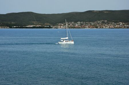 sailboat in the sea near the coast of Nessebar in Bulgariaの写真素材