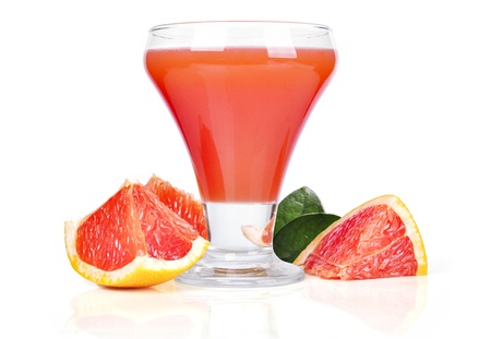 Glass of pink grapefruit juice isolated on whiteの写真素材
