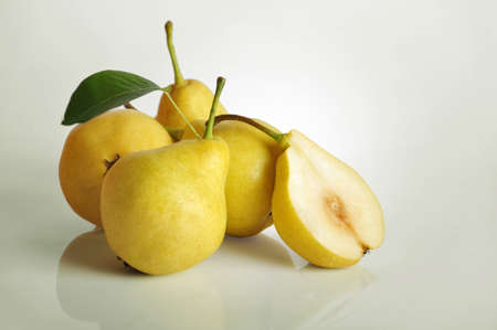 Rip fresh pears on light backgroundの写真素材