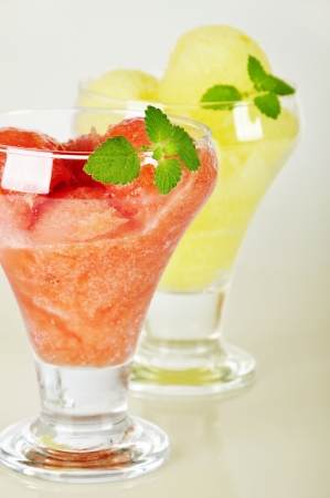 Melon and watermelon sorbet  in glass  ice-cream bowl の写真素材