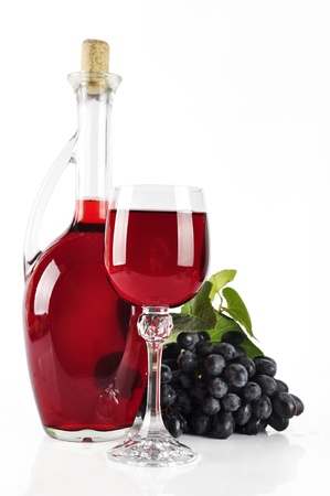 Ripe grapes, wine glass and bottle of wine isolated on whiteの写真素材