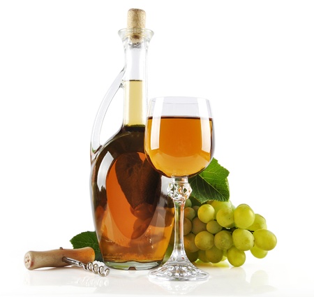 Ripe grapes, wine glass and bottle of wine isolated on whiteの写真素材
