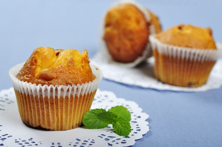 Muffins with mint on blue background  Small shallow dofの写真素材