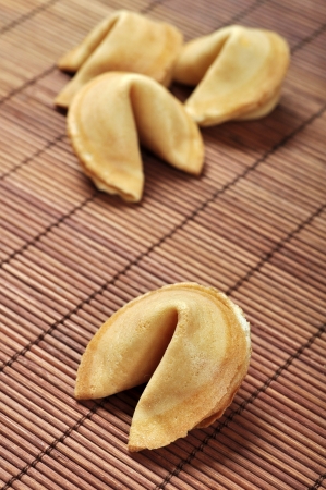 Some Fortune Cookies on bamboo placematの写真素材