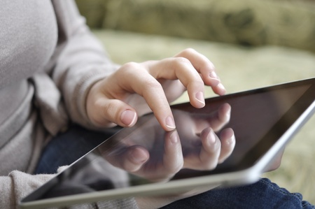 young woman using tablet pc at homeの写真素材