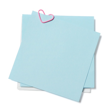 blue and white sticky notes with paper clip in shape of heart on white backgroundの写真素材
