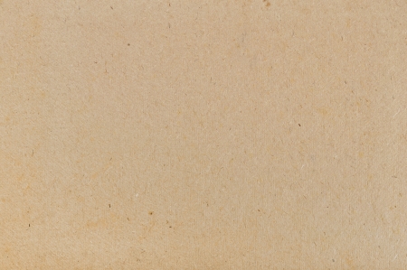 brown cardboard texture closeup, natural rough textured paper backgroundの写真素材