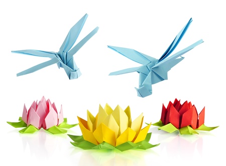 origami blue dragonfly over flowers lotus over white backgroundの写真素材